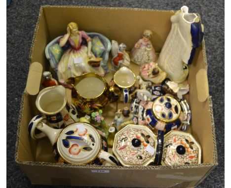 A Staffordshire figure of a lady sat on a sofa 'Felice'; Staffordshire ceramics in the Imari palette, including tea pot, crea