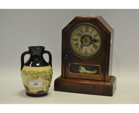 A Victorian mahogany mantel clock Roman numerals twin-winding holes c.1890; an early-20th Century twin handled vase painted w