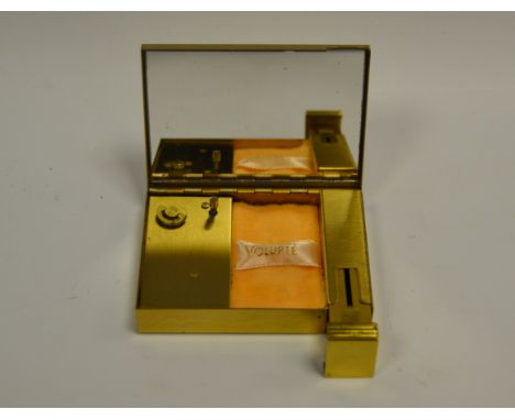 A Magnin and Co musical gilt metal compact and lipstick, playing Always Waltz, 8.5cm long, boxed