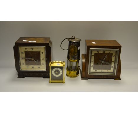 An oak mantel clock, c.1930; another; an Eccles Miners lamp; a Quartz brass carriage clock (4)