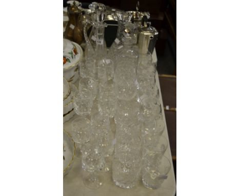 Glassware - cut glass decanters; a carafe; brandy balloons; whisky tumblers; wine glasses  etc.