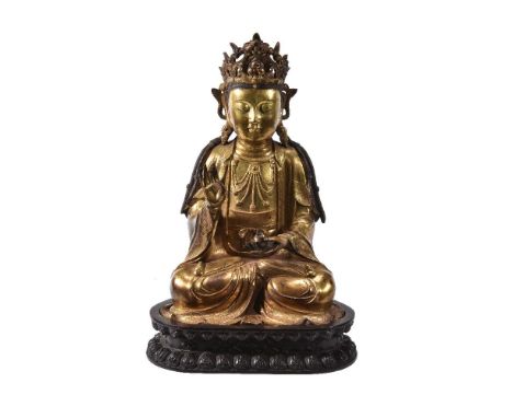 A Chinese gilt-bronze figure of Buddha, possibly late Qing, China, seated in padmasana, his hands in abhaya and dhyana mudra,