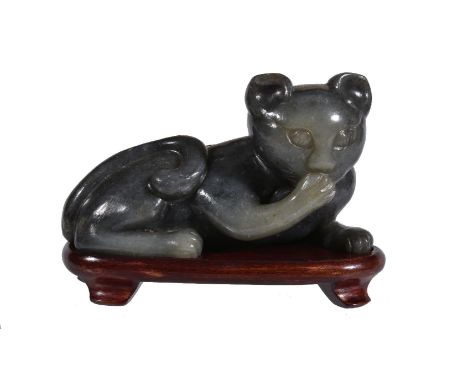 A grey and celadon jade ‘cat’ carving, the grey and celadon parts of the stone skilfully shaped into a recumbent cat, carved 