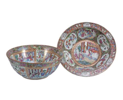 A Cantonese Famille Rose punch bowl, Qing Dynasty, 19th century, typically decorated with panels of figures within key fret b