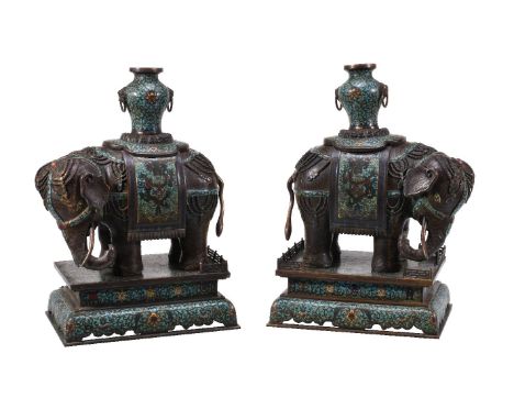 A pair of Chinese bronze Cloisonné and Champlevé enamel elephants, Qing Dynasty, circa 1900, each standing four-square with h