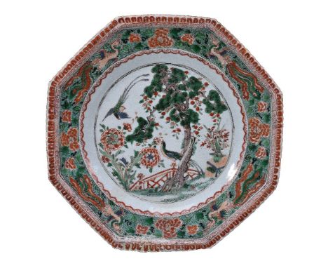 A Chinese Famille Verte octagonal dish, Kangxi, with two birds and central pine tree, 31.5cm diameter 清康熙 五彩凤鸟纹八棱盘