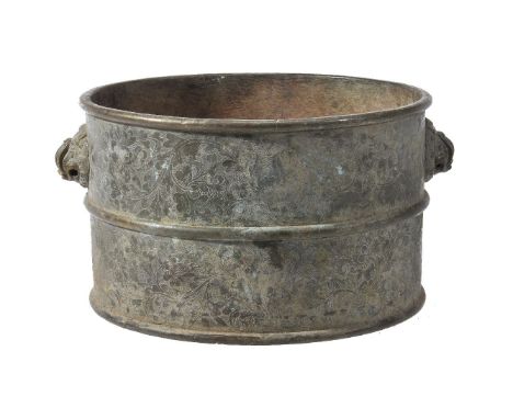 An unusual Chinese bronze censer, Qing Dynasty, 18-19th century, the cylindrical body rising from a flat base, flanked by a p