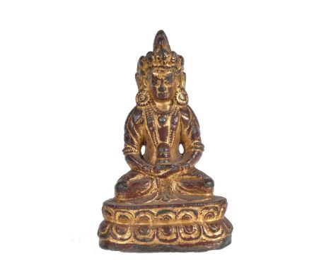 A Burmese lacquered and gilded bronze figure of Amitayus, 17th/18th century or later, seated on a double lotus, his hands in 