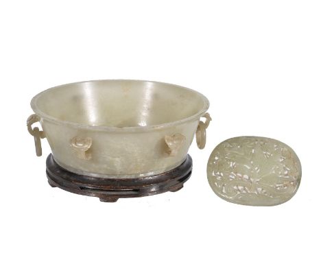 A Chinese celadon jade bowl, possibly Republican Period, of circular form, with white and other inclusions, the exterior six 