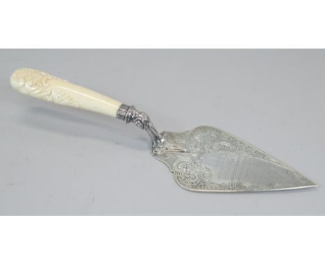 A silver presentation trowel, with carved ivory handle, the handle engraved presented to Joseph Ellis Trustees Arms Houses, W