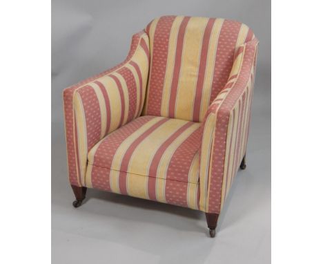 An Edwardian mahogany and boxwood strung tub shaped chair, upholstered with striped fabric, on ceramic castors