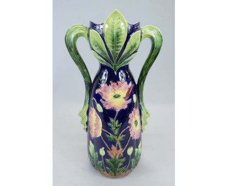 A Continental Art Nouveau style two handled vase, decorated in majolica glazes with flowers etc., possibly Austrian, 34cm hig