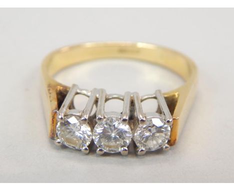 An 18ct gold three stone diamond ring, with three round brilliant stones approx 0.25cts each, 4.7g all in. 