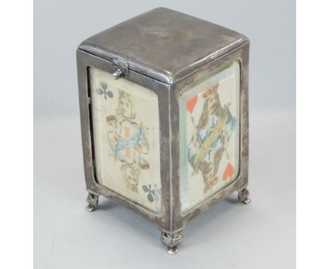 A silver playing card box, the hinged lid with a leather sprung interior, the bevelled plates applied with playing cards, and