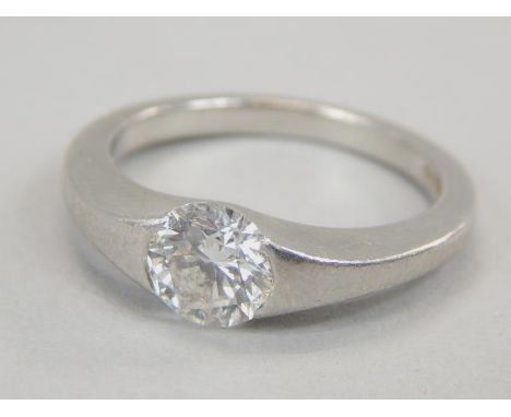 A platinum diamond solitaire ring, with central round brilliant diamond, approx 0.71cts, in tension setting, 5.5g all in. 