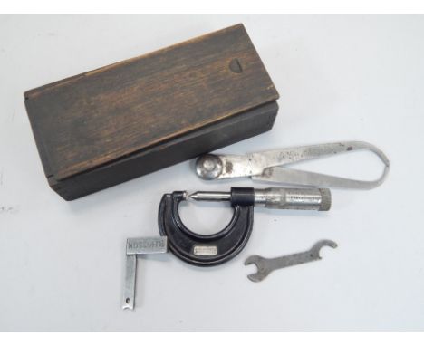 Engineering tools, a miniature set square stamped R Hodson, a micrometer stamped Slocombe, and a set of calipers.  