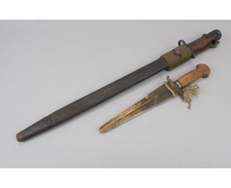 An early 20thC bayonet, with Wilkinson Sword blade 1907 and a small Continental dagger, with brass belt clip (2)