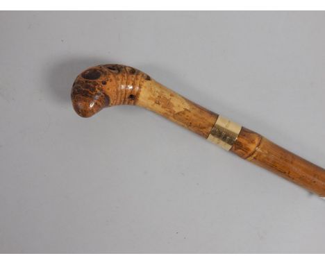 An Indian walking stick, the yellow metal handle stamped from HRH The Prince of Wales India 1878, 90cm long.