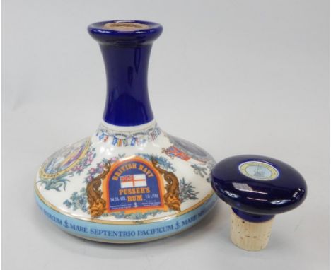 A bottle of Pussers commemorative rum, made to commemorate Admiral Lord Nelson, in a Wade decanter, and another decanter and 