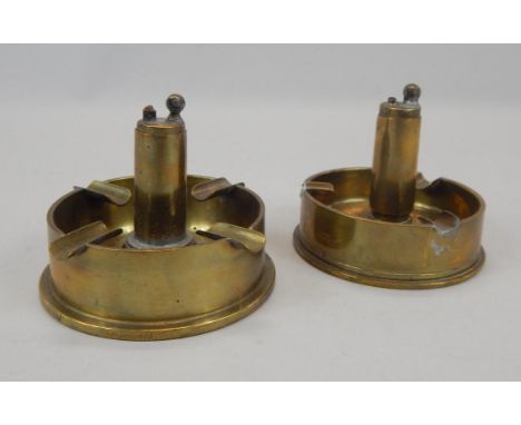 Two items of World War II Trench Art, each converted into an ashtray, with a central lighter, both dated 1942
