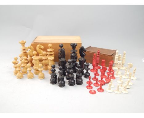 A red stained bone part chess set, and a part ebonised wooden chess set.