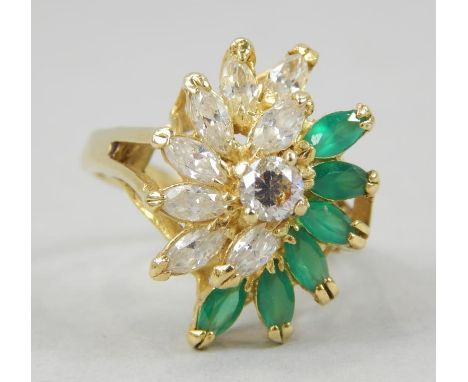 A ladies dress ring, with green marquise stones and diamond set, abstract design, stamped 18K, 8.7g all in