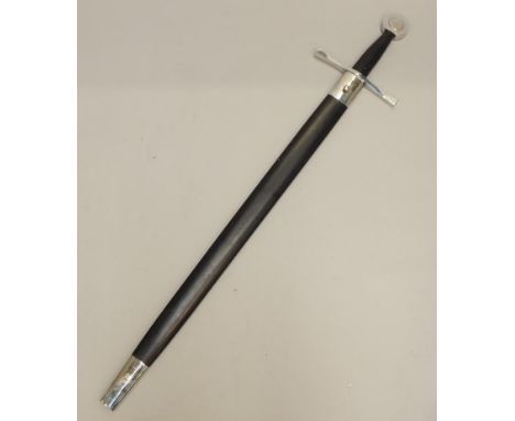A large replica sword, with chrome plated mounts and simulated leather handle and scabbard.
