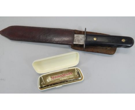 A hunting knife in leather scabbard, scabbard stamped GM Double, by repute forming the property of a Sergeant G Williams and 