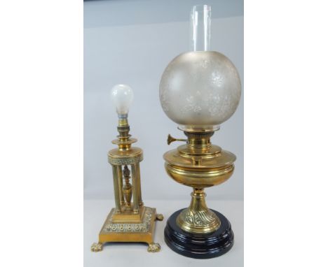 Two items of 19thC metalware, a Victorian glass oil lamp with frosted glass shade and ebonised plinth, 57cm high, and a table