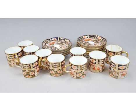 A collection of Royal Crown Derby coffee cans and saucers, each printed with the Imari pattern, number 2451