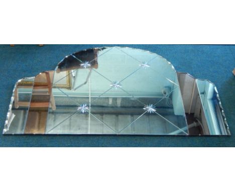 A 1950s over mantel mirror, in Art Deco style, with an arched top and part engraved decoration, 138cm wide.