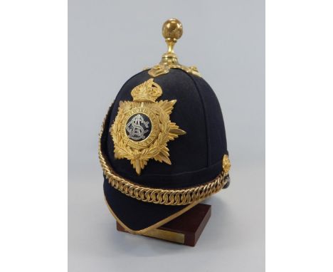 An early 20thC Army Service Corps officer's dress helmet, with gilt and silvered metal sentinel badge, made by Cater & Co, 56