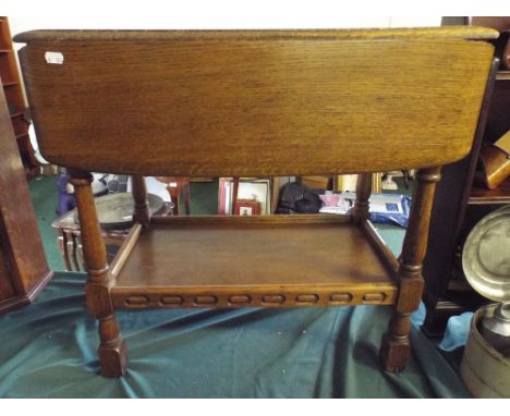 An Oak Drop Leaf Trolley with Single Drawer and Stretcher Shelf (Missing Castors). 