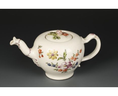 A MID-18TH CENTURY VIENNA PORCELAIN TEAPOT, enamelled in polychrome with sprays of naturalistic flowers, the moulded handle a