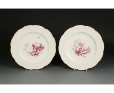 A PAIR OF MINTON PORCELAIN PLATES, with Sevres style purple painted scenes of a cherub riding a goat, and a cherub with bow a