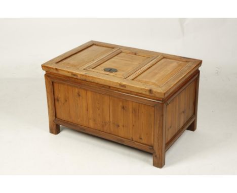 A CHINESE CYPRESS WOOD COFFER with a panelled top, late Qing/Republic, 19" high x 33" wide x 22" deep; together with a stool,
