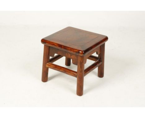 A SMALL CHINESE HUALI-WOOD STOOL of recessed-leg form, late Qing/Republic, 11" high x 11.5" square.  Provenance: The Collecti