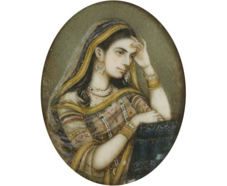 INDIAN ARTIST, 19th century A portrait miniature of a lady wearing traditional Indian costume, gouache and gilt on ivory, 2.5