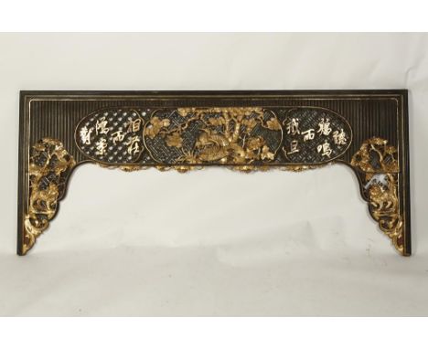 A LARGE CHINESE PARCEL-GILT ARCHITECTURAL PANEL of arched form, the centre with birds amongst rocks and foliage flanked by ch