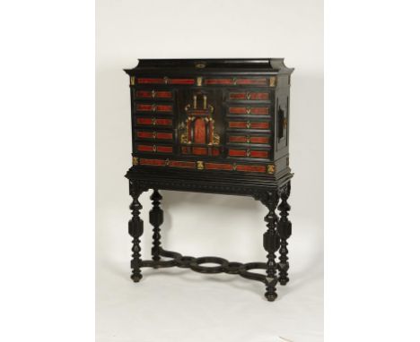 A 19TH CENTURY EBONY AND TORTOISESHELL 'ANTWERP' STYLE CABINET ON STAND, the central door decorated in an architectural manne