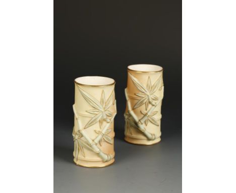 A PAIR OF EARLY 20TH CENTURY ROYAL WORCESTER PORCELAIN SPILL VASES, modelled in the form of bamboo, 4.75" high