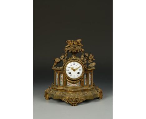 A 19TH CENTURY FRENCH PORCELAIN AND ORMOLU MOUNTED MANTLE CLOCK, the convex dial with blue Roman numerals, with a two train '