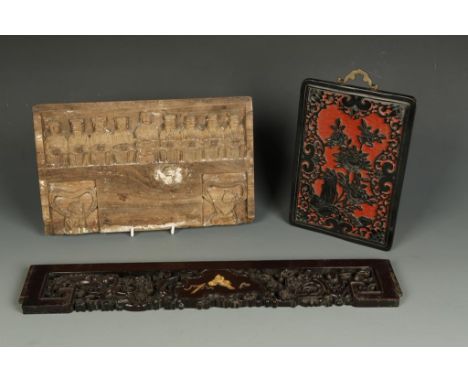 A CHINESE HONGMU PANEL with a central ivory-inlaid area surrounded by carved prunus, Qing, 19th century, 21.5" long; together