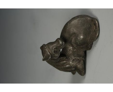 A CHINESE LEAD SCROLL WEIGHT, in the form of a recumbent horse with its' head turned to the rear, probably Qing, 2.25" long
