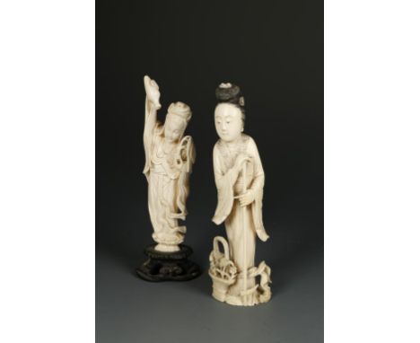 TWO CHINESE IVORY STANDING FEMALE FIGURES, one holding an axe and standing beside flowers, Qing, 5.75" high; the other holdin