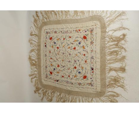 A CHINESE SILK-EMBROIDERED COVER worked with polychrome flowers and foliage on a cream ground, late Qing/Republic, with a tas