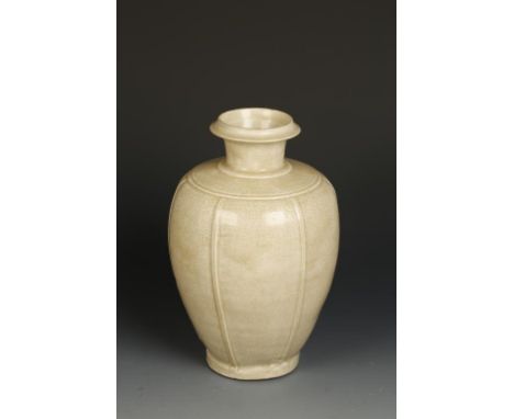 A CHINESE YUE STYLE VASE, the ovoid body with vertical bow-string lines, below a flared neck, the crackled glaze of light oli