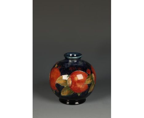 A PAIR OF WILLIAM MOORCROFT GLOBE VASES, each decorated in the Pomegranate pattern against a blue/green ground, the underside