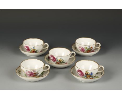 A SET OF FIVE MARCOLINI STYLE 19TH CENTURY MEISSEN TEACUPS AND SAUCERS, painted with floral decoration with gilt dental borde