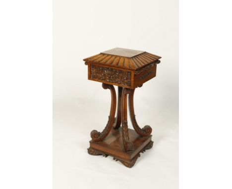 AN ANGLO-INDIAN ROSEWOOD TEAPOY with central square panel within a moulded border, the interior fitted with four lidded compa